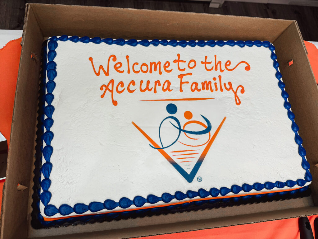 Celebration cake displayed at Accura HealthCare community welcome event