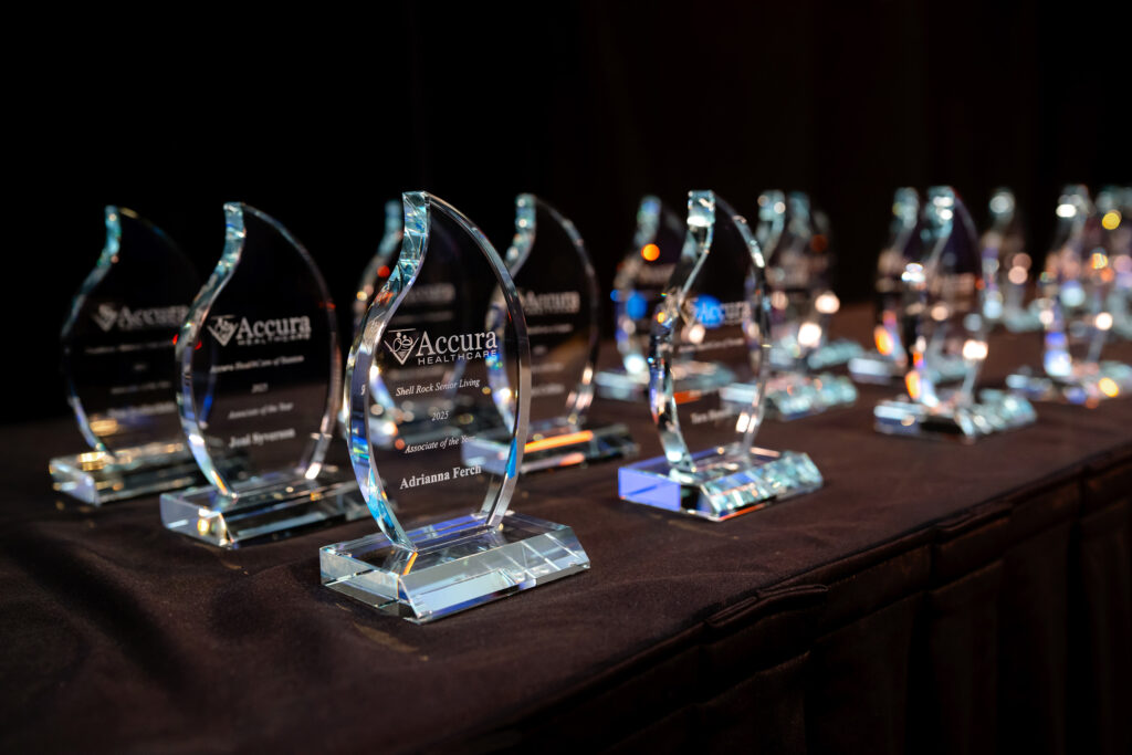 Associate of the Year awards displayed during Accura HealthCare’s 2026 Awards Banquet and anniversary celebration.