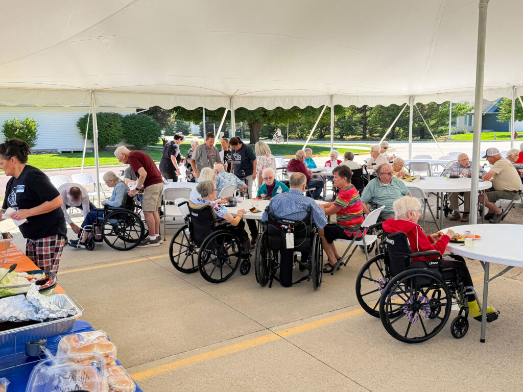 Residents and team members gathering for Accura HealthCare of Milford's Silver Award celebration