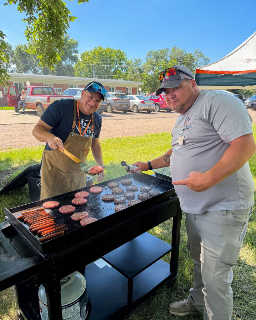 Accura HealthCare team members grilling during the Milford Silver Award cookout
