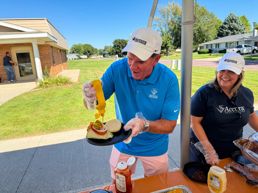 Members of Accura HealthCare's Resource Center team serve residents and team members during Accura HealthCare of Milford's Silver Award celebration