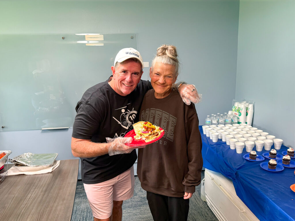 Resident and Accura HealthCare team member during the Traditions Memory Care of Newton Silver Award celebration