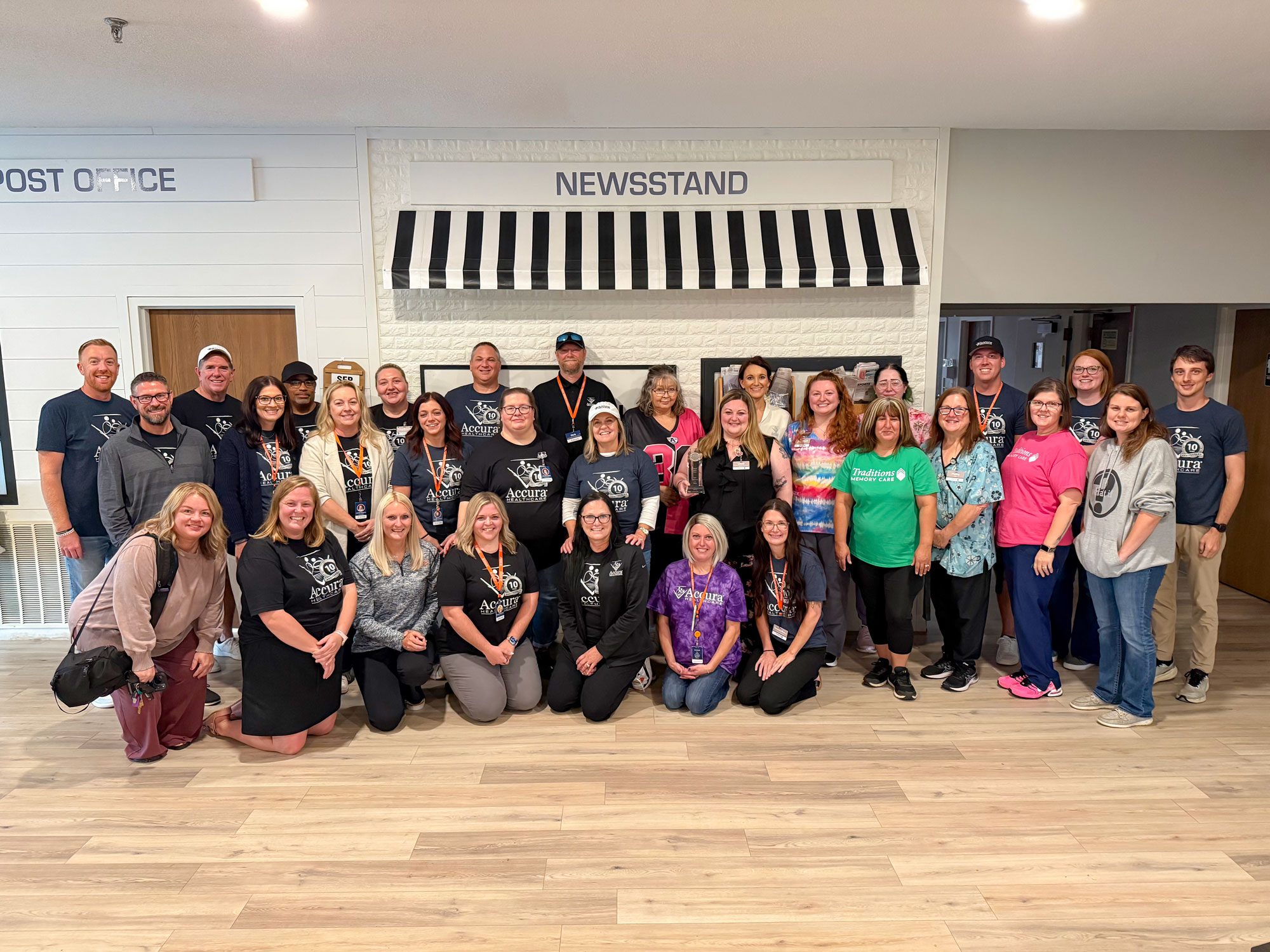 Traditions Memory Care of Newton and Accura HealthCare Resource Center team members celebrating the community’s 2026 Silver – Achievement in Quality Award